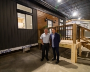 Matt Jamieson and Chief Mark Hill standing in front of Tiny Homes Sparrow model