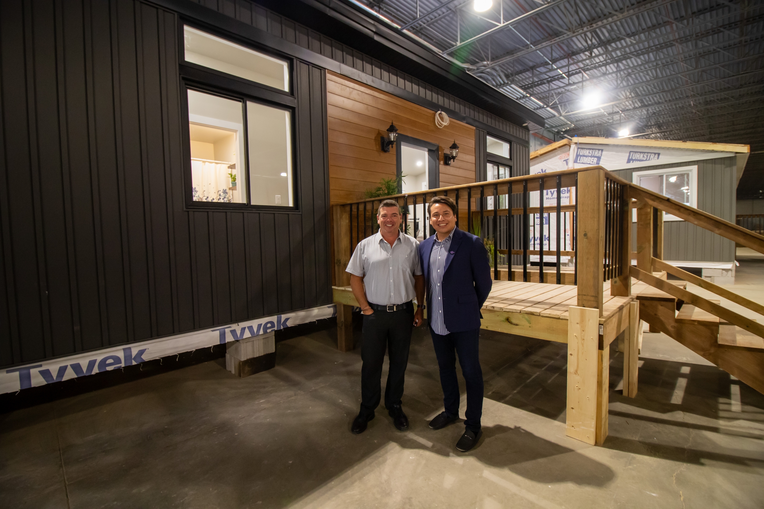 Matt Jamieson and Chief Mark Hill standing in front of Tiny Homes Sparrow model
